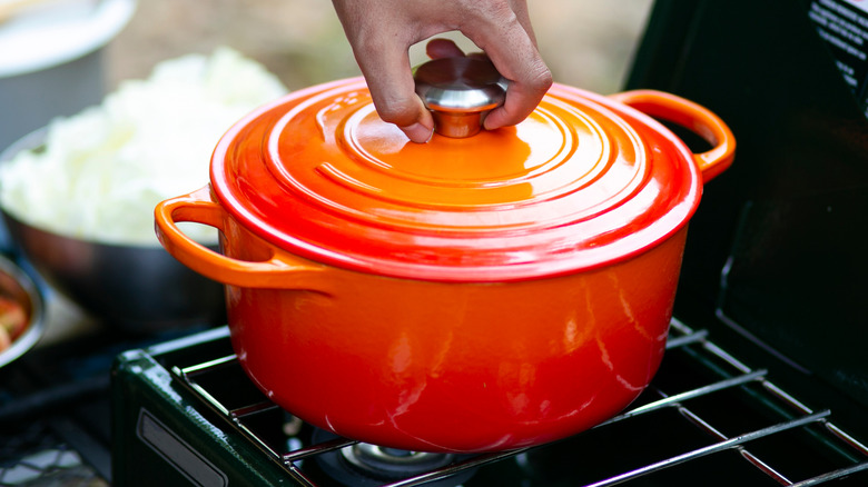 Orange Dutch oven on a stove