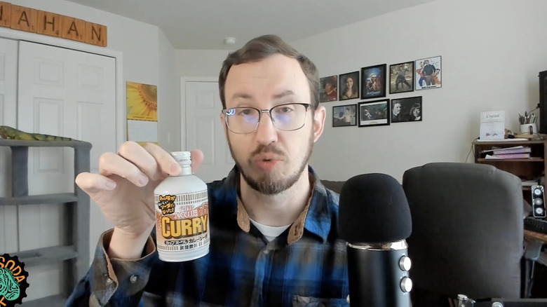 Soda Jerk holding Cup Noodle Curry Soda