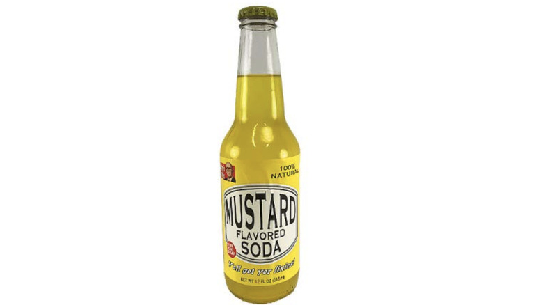 Mustard-flavored soda on white background