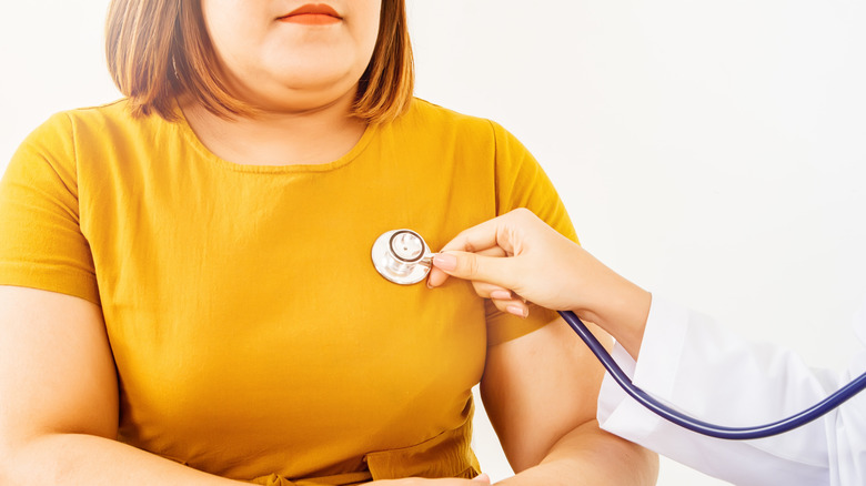 A doctor examines a patient