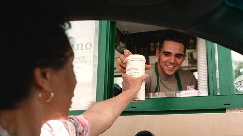 Customer getting drive-thru Starbucks coffee