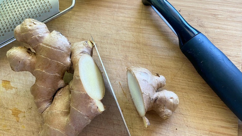 sliced ginger root and peeler