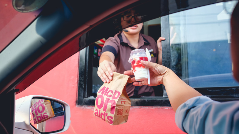 Person receiving drive-thru McDonald's order