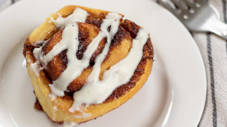 cinnamon roll on white plate