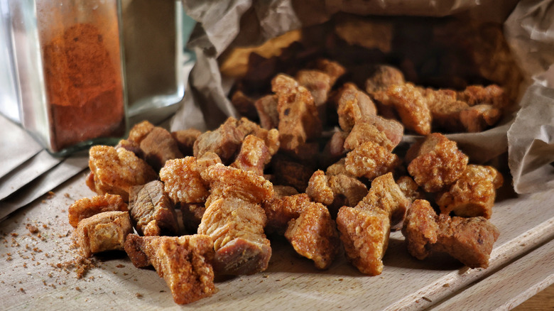 Pork cracklins spilling out of paper bag