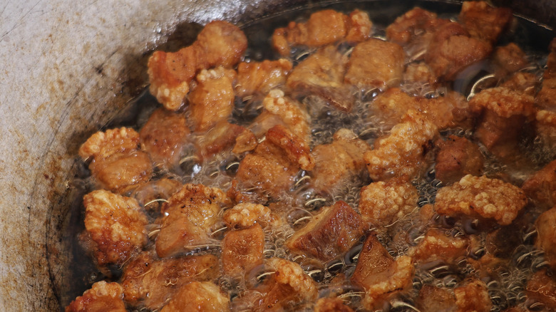 Pork cracklins frying in oil