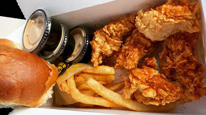 Close-up of Golden Chick fried chicken and yeast roll