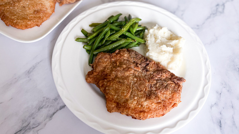 southern fried pork chops on plate 