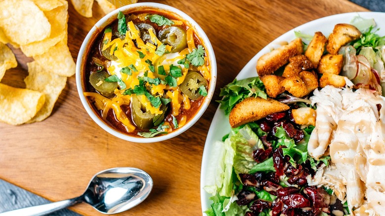 Salad, chili bowl, and potato chips