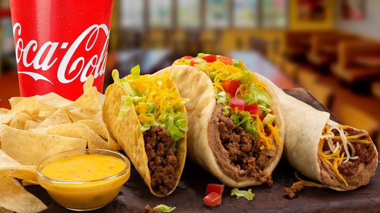 Coca Cola and three tacos