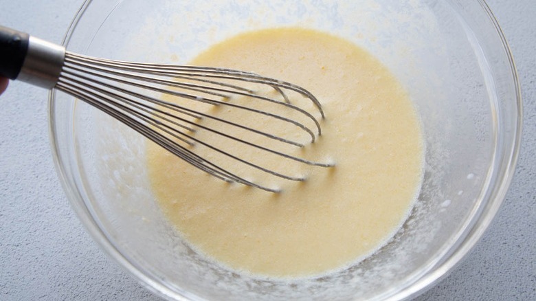 whisking up buttermilk cornbread batter