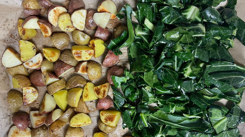 Potatoes and collard greens on sheet pan