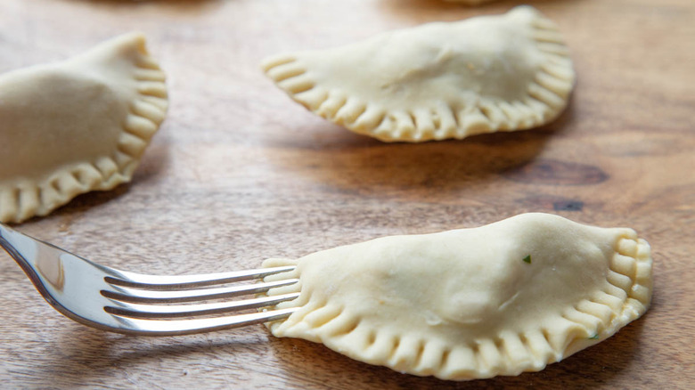 crimping empanada edges with fork