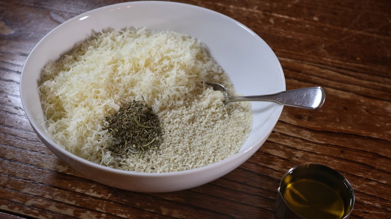 bowl of breadcrumbs, herbs, and cheese.