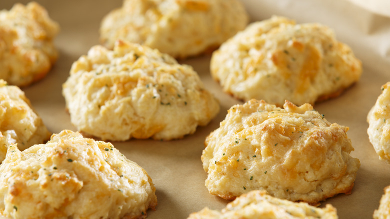 cheddar biscuits on baking sheet