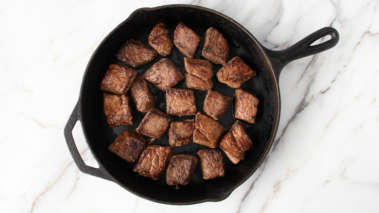 browned beef tips in skillet