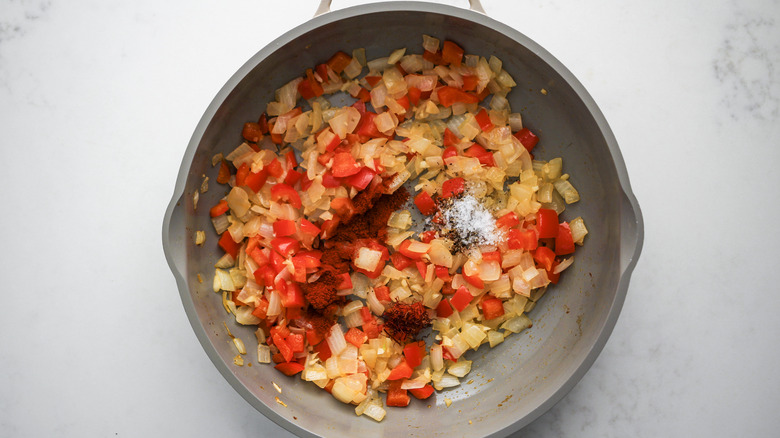 spices and veggies in skillet