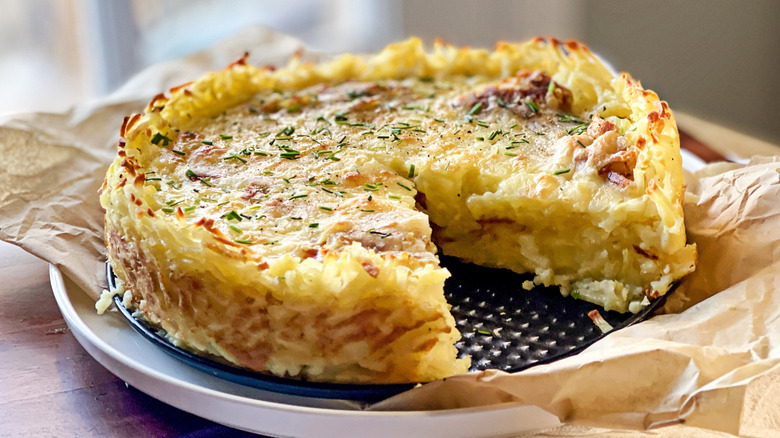 Spanish tortilla-inspired quiche with hashbrown crust