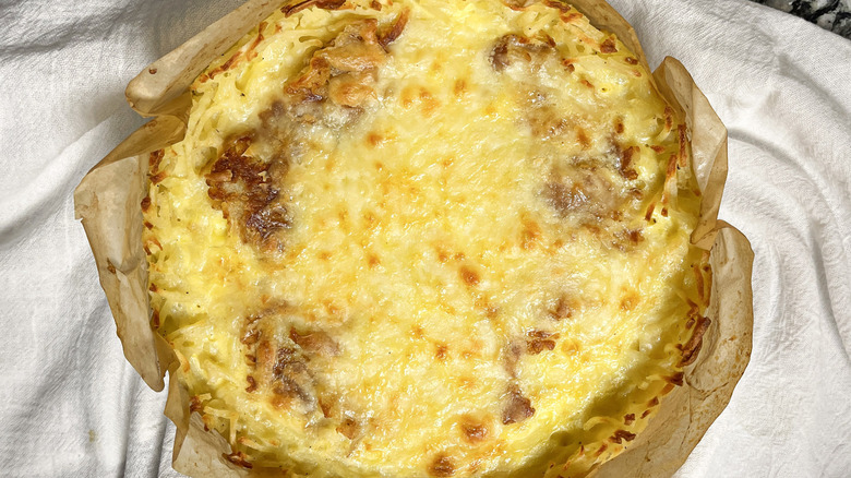 Spanish tortilla-inspired quiche with hash brown crust