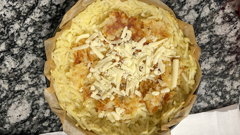 cheese sprinkled on hash brown crust