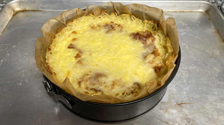 baked Spanish tortilla-inspired quiche with hash brown crust