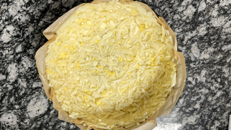 hash browns in parchment paper-lined pan