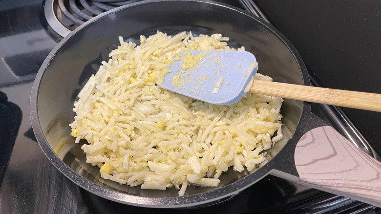 cooking hash browns in skillet