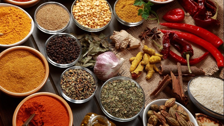 ground and whole Indian spices in bowls