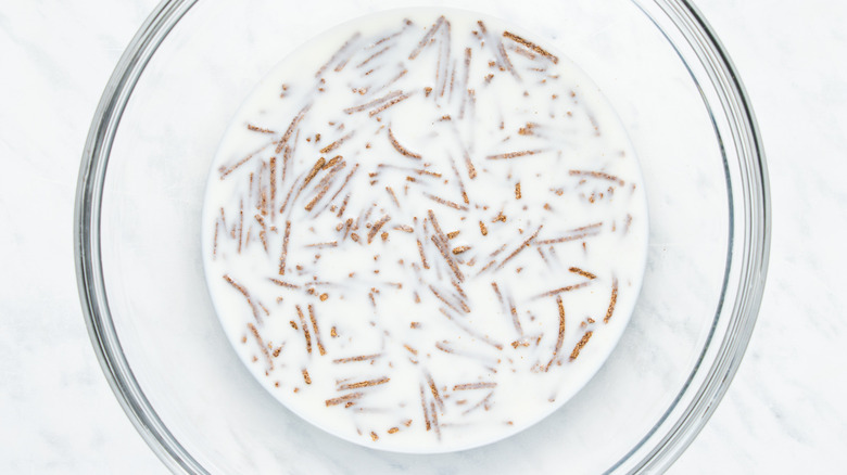 wheat bran and milk in bowl 