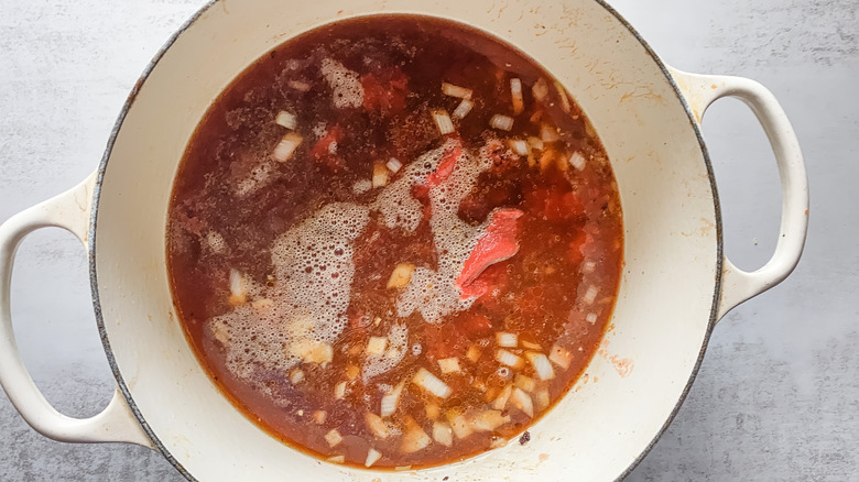 pot of tomatoes and broth