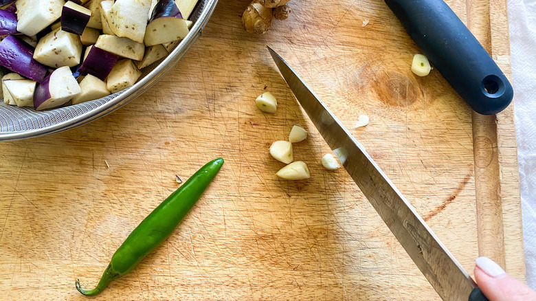 chopped eggplant, garlic, whole serrano