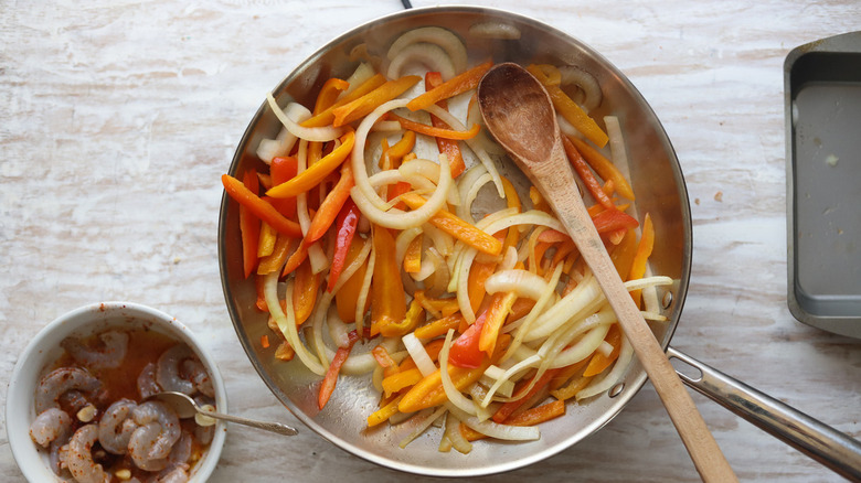 peppers and onions in pan