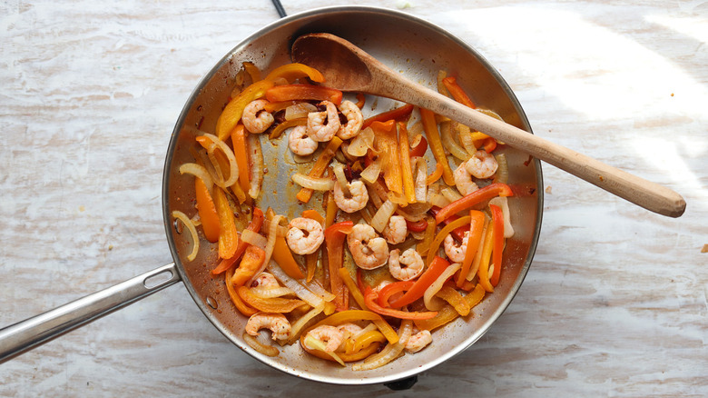 vegetables and shrimp in pan