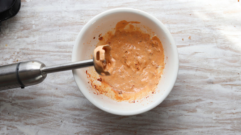 orange mayonnaise in white bowl