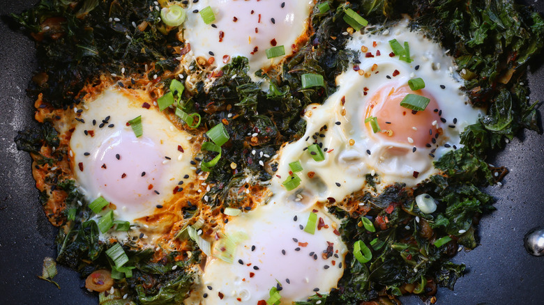 skillet of gochujang kale and eggs