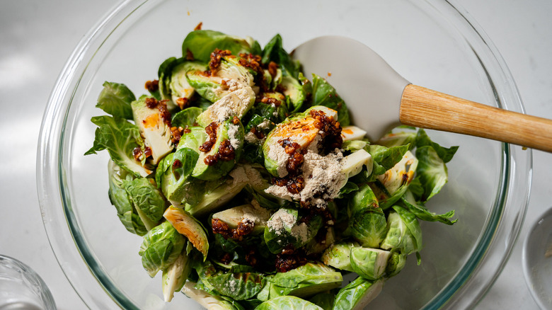 brussels sprouts in bowl with seasoning