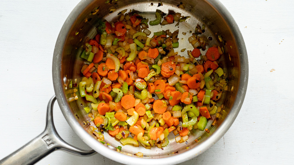 cooking veggies for spicy lentil soup