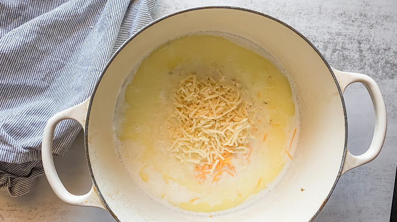 Photo of cheese being melted into sauce