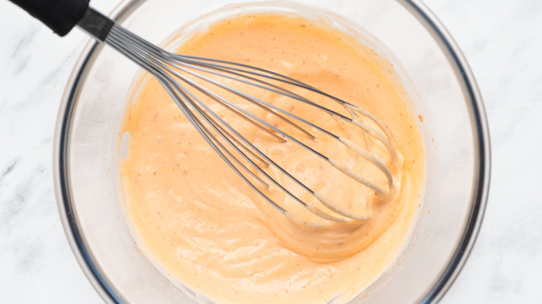 spicy mayo and whisk in bowl