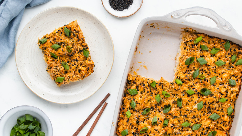 Salmon sushi bake in baking dish and served on plate