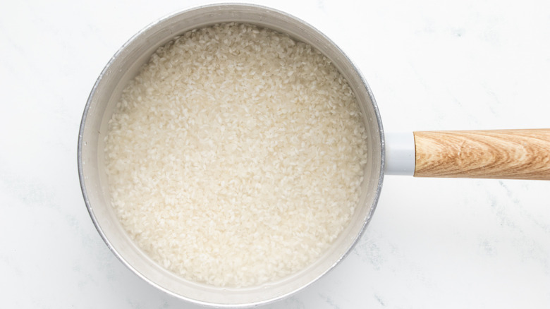 Sushi rice cooking in pan