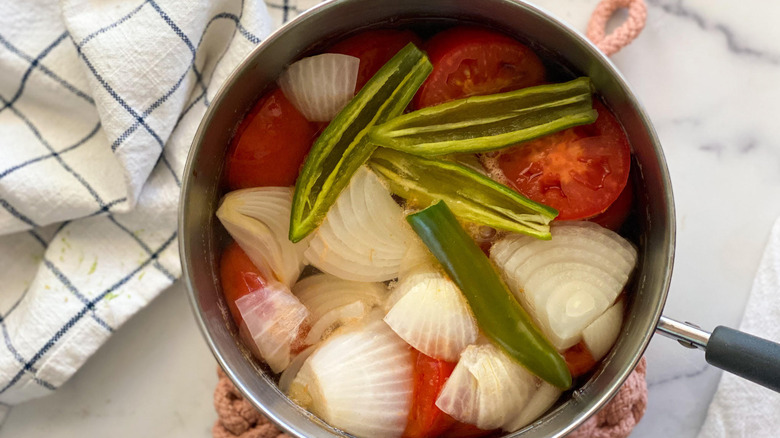 Spicy Salsa Roja Recipe ingredients in a saucepan