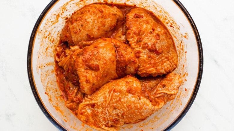 marinated chicken thighs in bowl