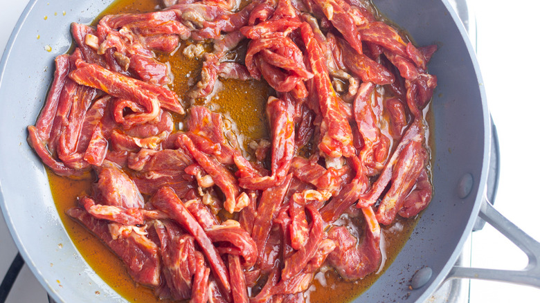 Marinating beef strips