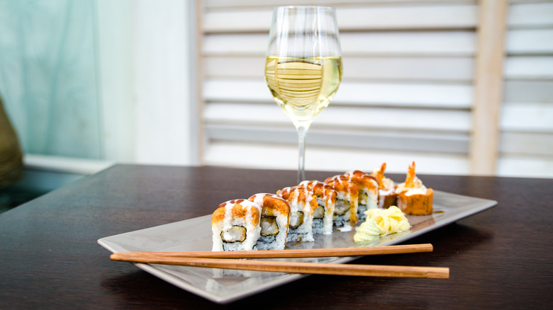 Sushi on plate with wine