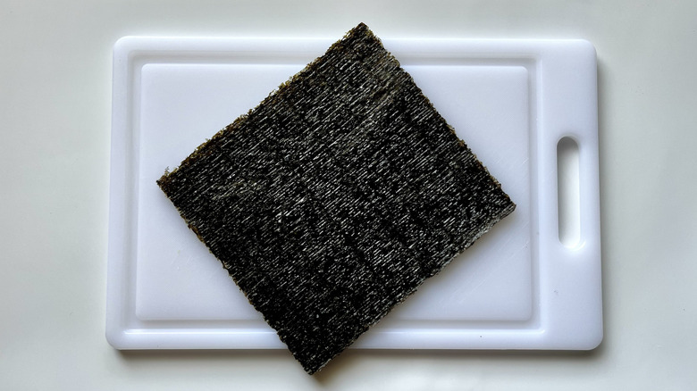 large nori sheet on cutting board