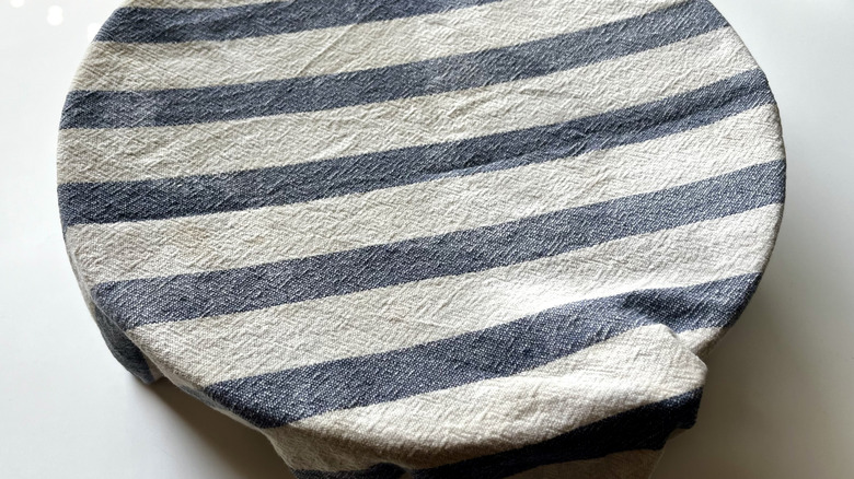 striped kitchen towel over bowl