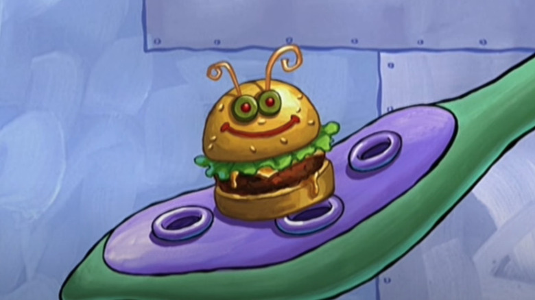 Squidward holding Pipsqueak Patty