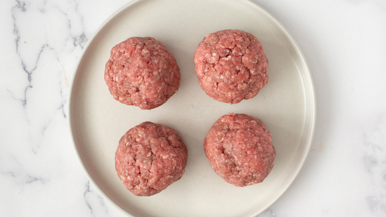 raw burger patties