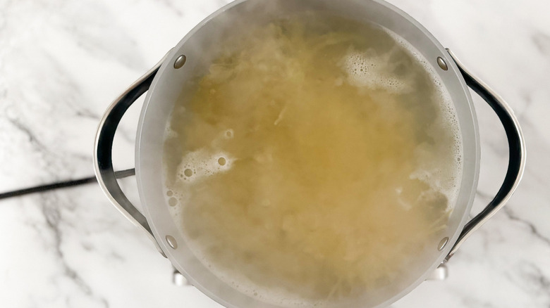 noodles in pot of water